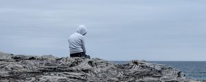 Preview wallpaper man, alone, sad, rock, sea