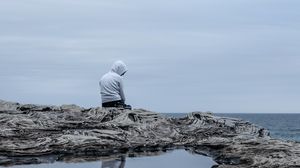 Preview wallpaper man, alone, sad, rock, sea