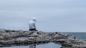 Preview wallpaper man, alone, sad, rock, sea