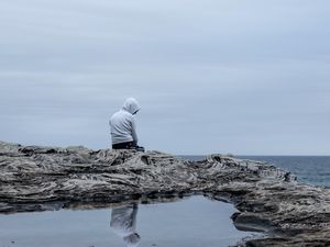 Preview wallpaper man, alone, sad, rock, sea