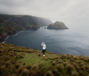 Preview wallpaper man, alone, sea, cliff, landscape, nature