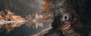 Preview wallpaper man, alone, trees, river, autumn, free