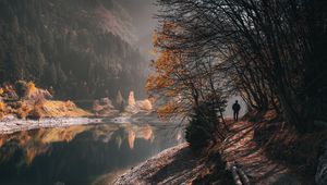 Preview wallpaper man, alone, trees, river, autumn, free