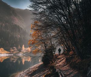 Preview wallpaper man, alone, trees, river, autumn, free