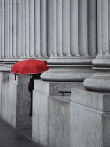 Preview wallpaper man, alone, umbrella, columns, red