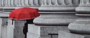 Preview wallpaper man, alone, umbrella, columns, red