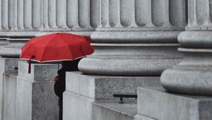 Preview wallpaper man, alone, umbrella, columns, red