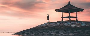 Preview wallpaper man, alone, water, gazebo, shore, sunset