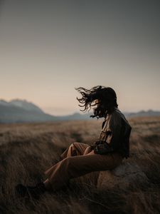 Preview wallpaper man, alone, wind, hair, grass