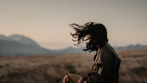 Preview wallpaper man, alone, wind, hair, grass