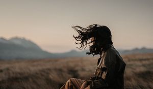 Preview wallpaper man, alone, wind, hair, grass