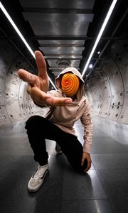 Preview wallpaper man, anonymous, hood, spiral, gesture, sneakers