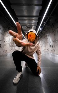 Preview wallpaper man, anonymous, hood, spiral, gesture, sneakers