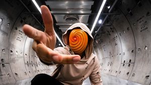 Preview wallpaper man, anonymous, hood, spiral, gesture, sneakers