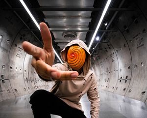 Preview wallpaper man, anonymous, hood, spiral, gesture, sneakers