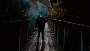 Preview wallpaper man, anonymous, mask, neon, smoke, bridge