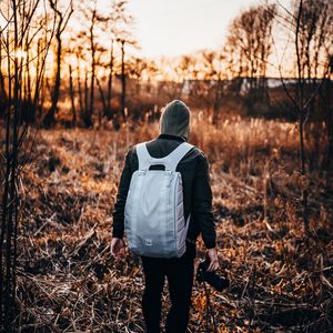 Preview wallpaper man, backpack, hood, camera, photographer