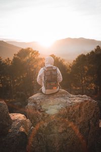 Preview wallpaper man, backpack, hood, nature, alone