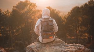 Preview wallpaper man, backpack, hood, nature, alone