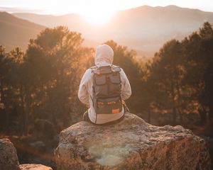 Preview wallpaper man, backpack, hood, nature, alone