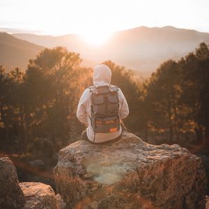 Preview wallpaper man, backpack, hood, nature, alone