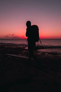 Preview wallpaper man, backpack, silhouette, beach, dark