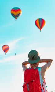 Preview wallpaper man, balloons, sky, cap, backpack