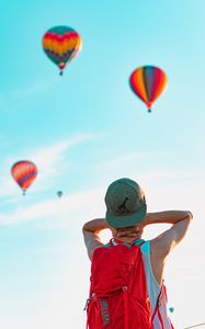 Preview wallpaper man, balloons, sky, cap, backpack