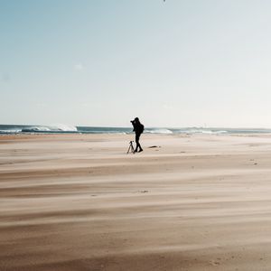 Preview wallpaper man, beach, alone, photographer, nature