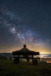 Preview wallpaper man, bench, starry sky