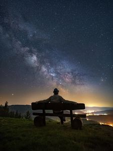Preview wallpaper man, bench, starry sky