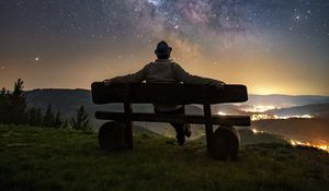 Preview wallpaper man, bench, starry sky