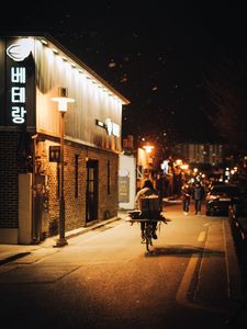 Preview wallpaper man, bike, courier, street, lights, night