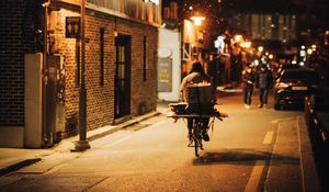 Preview wallpaper man, bike, courier, street, lights, night