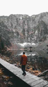 Preview wallpaper man, bridge, lake, mountains, nature