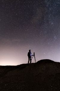Preview wallpaper man, camera, starry sky, night, dark