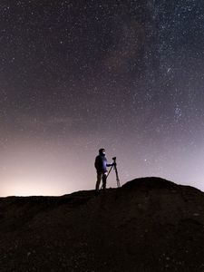 Preview wallpaper man, camera, starry sky, night, dark