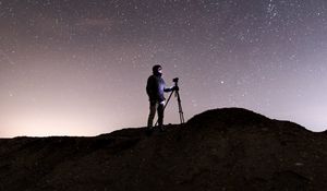 Preview wallpaper man, camera, starry sky, night, dark