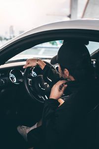 Preview wallpaper man, car, steering wheel, salon, dark