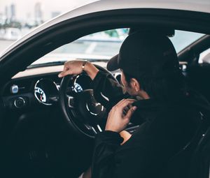 Preview wallpaper man, car, steering wheel, salon, dark