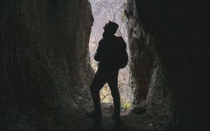 Preview wallpaper man, cave, dark, rock, nature