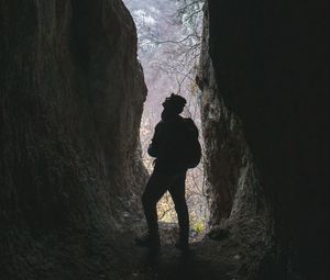 Preview wallpaper man, cave, dark, rock, nature