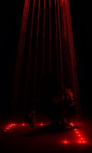 Preview wallpaper man, dark, rays, light, red