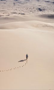 Preview wallpaper man, desert, aerial view, sand, footprints