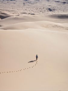 Preview wallpaper man, desert, aerial view, sand, footprints