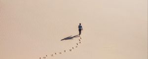 Preview wallpaper man, desert, aerial view, sand, footprints