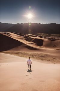 Preview wallpaper man, desert, dunes, sun, sand
