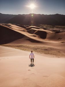 Preview wallpaper man, desert, dunes, sun, sand