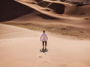 Preview wallpaper man, desert, dunes, sun, sand