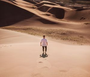 Preview wallpaper man, desert, dunes, sun, sand